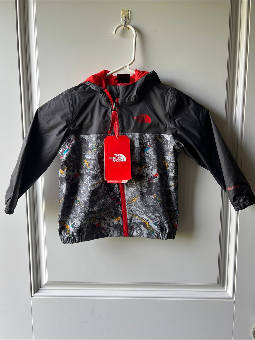 The North Face Kids Black Hooded Rain Jacket with Red Trim